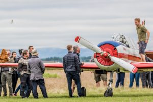 Snorri Bjarnvin Jónsson is standing on the wing of Yak-52 TF-BCX before the show on the plane at "Allt sem flýgur 2019" in Hella// Source: Andres Thorarinsson