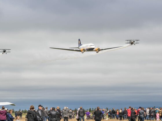 The formation flight of DC-3 TF-NPK (in center) with Pitts S-1S TF-ABJ (on the left) and Pitts S-2AE TF-TOP (on the right) during the "Allt sem flýgur 2019" in Hella // Source: Andres Thorarinsson