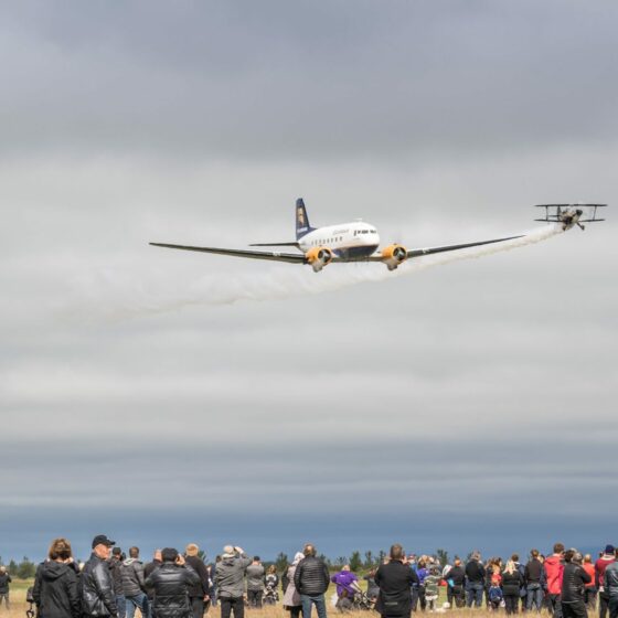 The formation flight of DC-3 TF-NPK (in center) with Pitts S-1S TF-ABJ (on the left) and Pitts S-2AE TF-TOP (on the right) during the "Allt sem flýgur 2019" in Hella // Source: Andres Thorarinsson